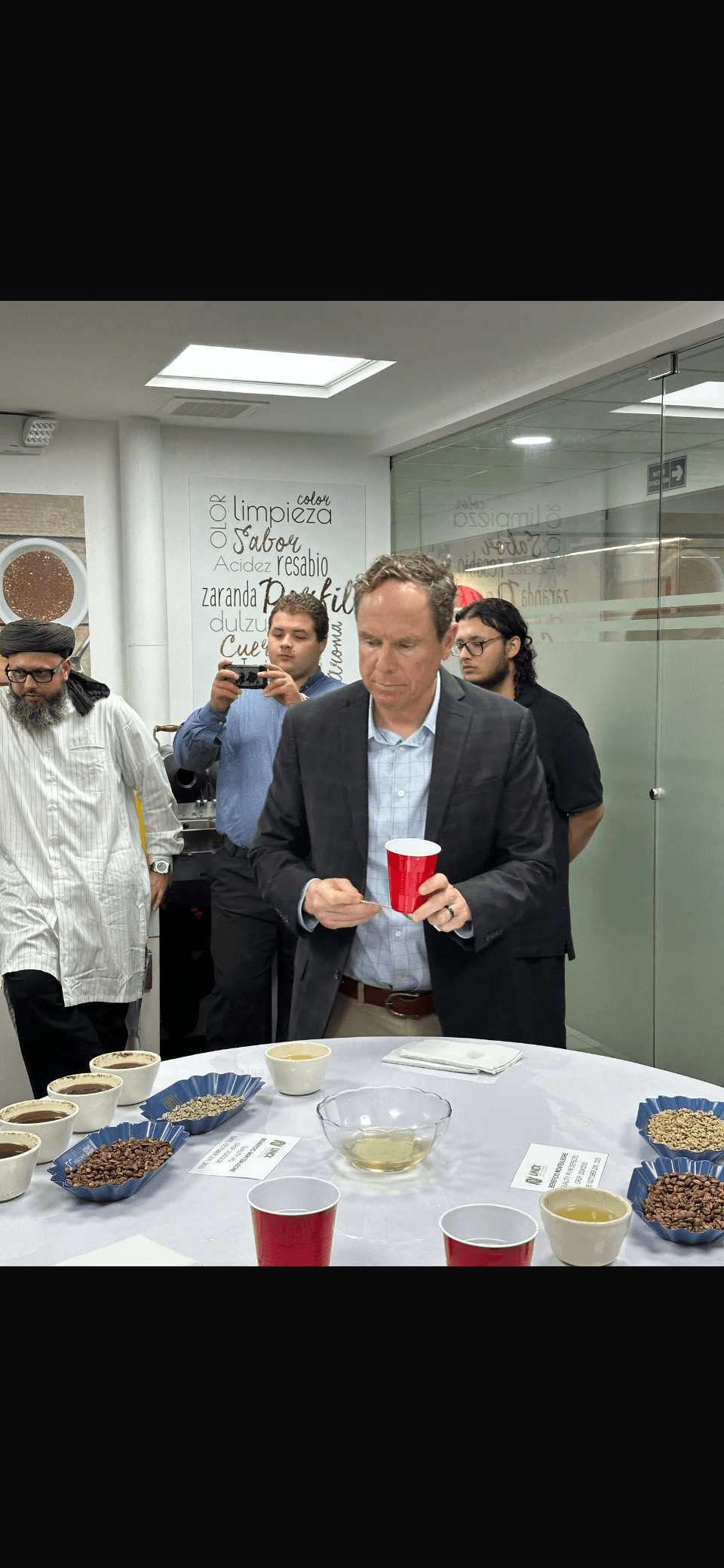 Tom Sessions evaluating coffee at a cupping session